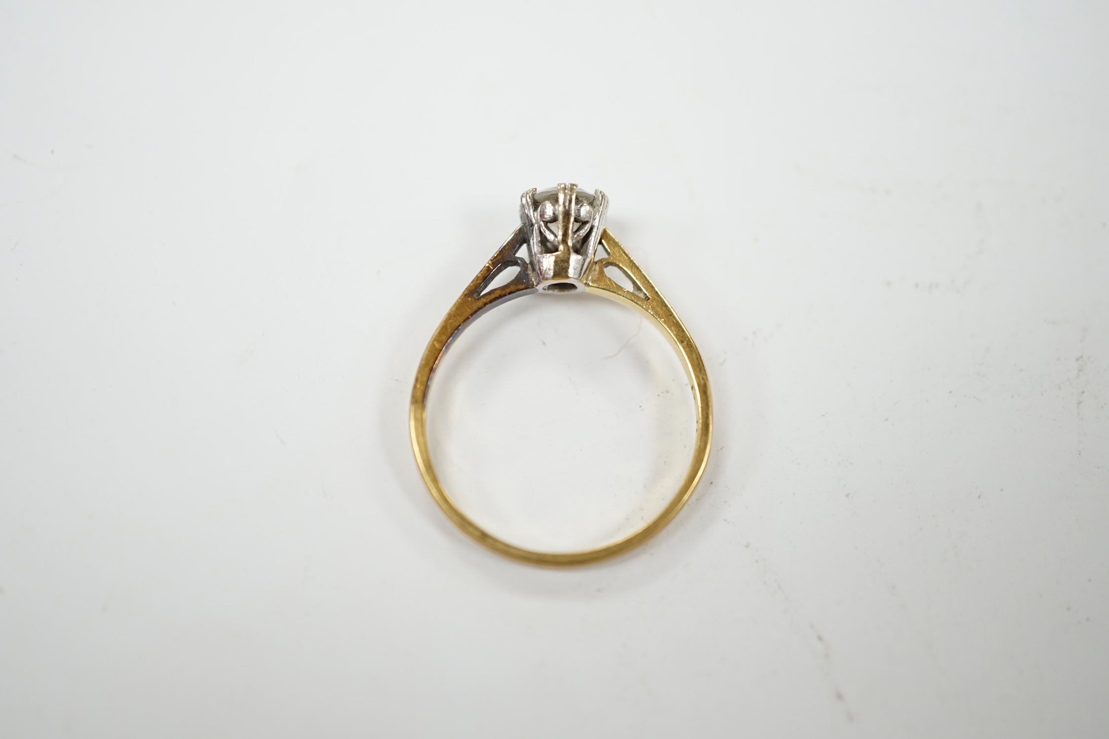 A modern 18ct gold and solitaire diamond set ring, size N, gross weight 2.8 grams. Condition - fair